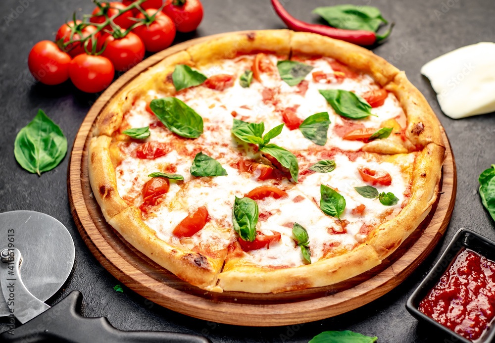 Pizza Margherita on a stone background