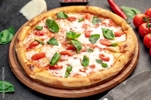 Pizza Margherita on a stone background 