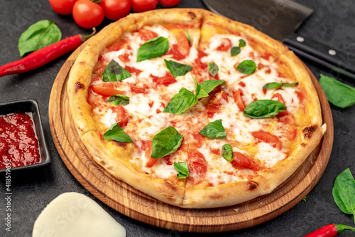 Pizza Margherita on a stone background 