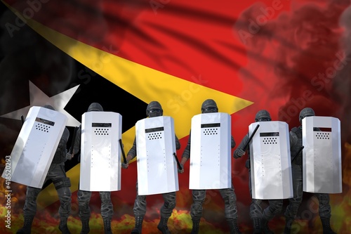 Wallpaper Mural Timor-Leste police officers in heavy smoke and fire protecting law against disorder - protest stopping concept, military 3D Illustration on flag background Torontodigital.ca