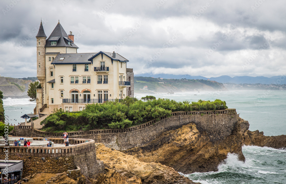 Biarritz, France - August 11 2019: Castle-like manor house on the coast facing the rough sea