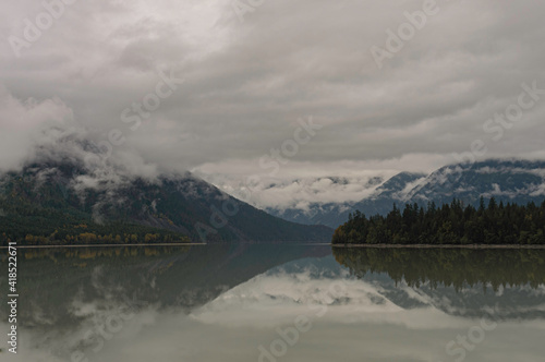Foggy day over lake and forest