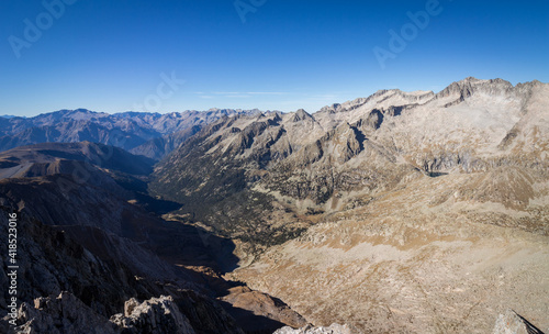 Spectacular valley views from the top of a mountain in the Pyrenees on a sunny summer day