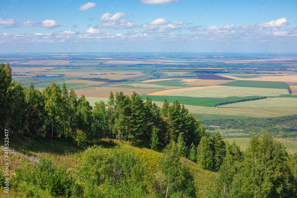 Beautiful view of the fields from a high altitude. Beautiful panoramic view of the terrain from a high vantage