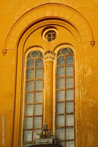 Decorative neoroman window on Slovak evangelical Augsburg church in Modra in evening spring sunshine,. Built in neoroman architectural style during 1825-1866. photo