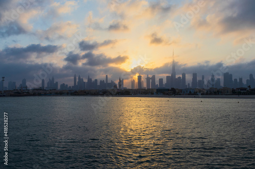 Dubai, UAE - 03.06.2021 Dubai public beach with city skyline on background.Sunrise hour. Outdoor