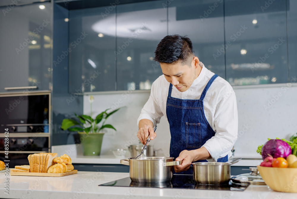 Men warm boiled food soup interior kitchen background. Men warm boiled food soup interior kitchen background.