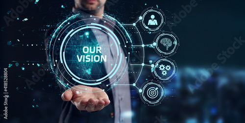 Business, Technology, Internet and network concept. Young businessman working on a virtual screen of the future and sees the inscription: Our vision photo