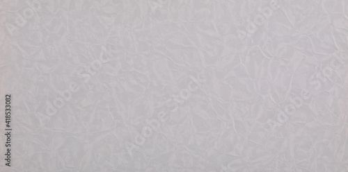 abstract background of crumpled gray wrapping paper © serikbaib