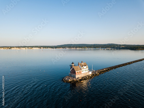 The Rockland Breakwater Lighthouse at the end of the mile long breakwater in Rockland Maine as viewed via an aerial drone image in the mornng light