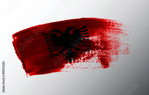 Albania flag illustrated on paint brush stroke