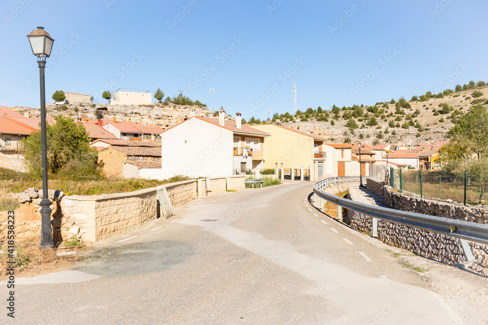 a paved road going through Castillejo de Robledo town, province of Soria, Castile and Leon, Spain