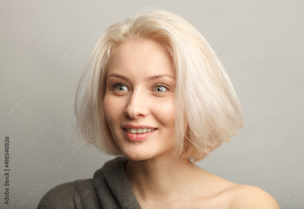 close up portrait of young woman wondering, smiling open-eyed isolated on gray background close up portrait of young woman wondering, smiling open-eyed isolated on gray background