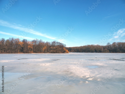 Nature in early spring. Ice melts on the lake. Spring landscape