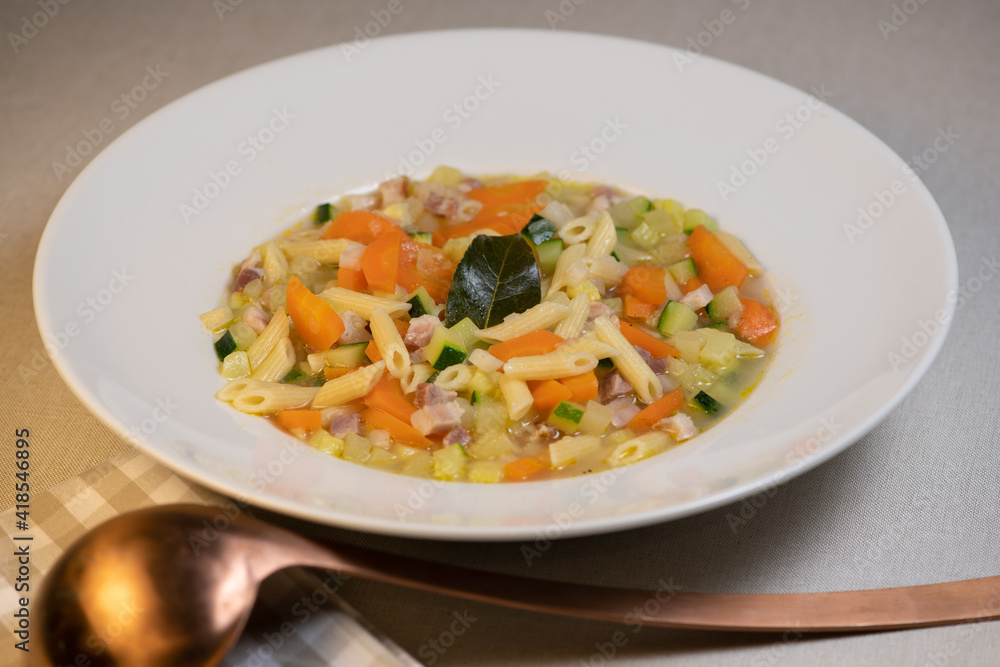 Fresh Vegetable soup and pasta in a white bowl , France Fresh Vegetable soup and pasta in a white bowl , France