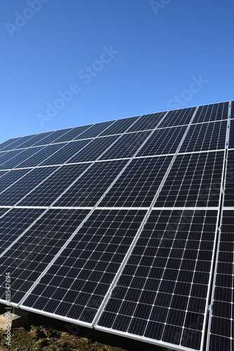 Solar panels against blue sky background.Against The Deep Blue Sky in suny weather