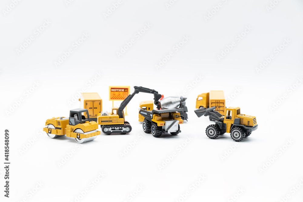 Fototapeta premium Construction site work vehicles on white background with copy space.