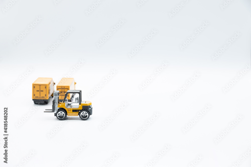 Miniature trucks and forklift for logistics and freight transport, on white background. Miniature trucks and forklift for logistics and freight transport, on white background.
