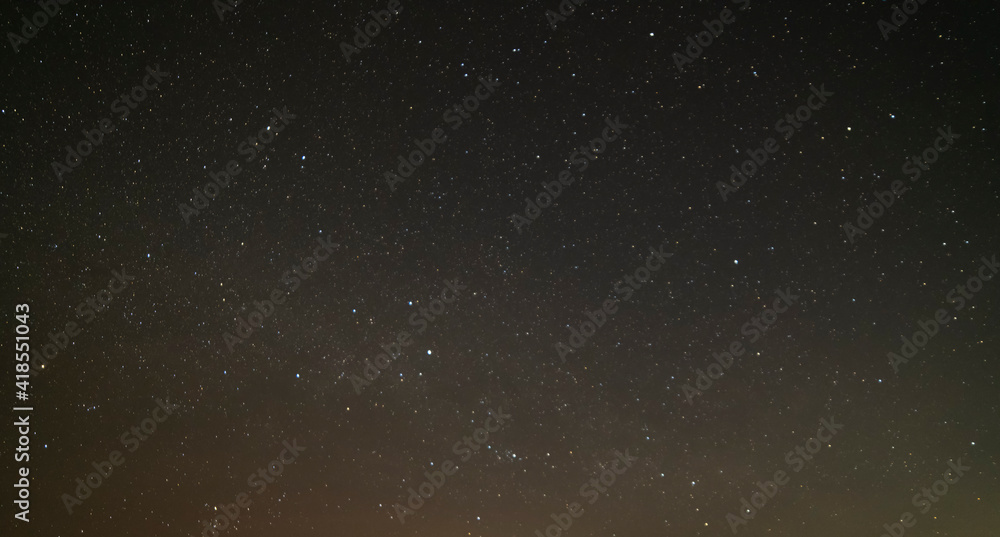 Obraz premium Beautiful winter dark starry sky. Night photography, astronomical background.