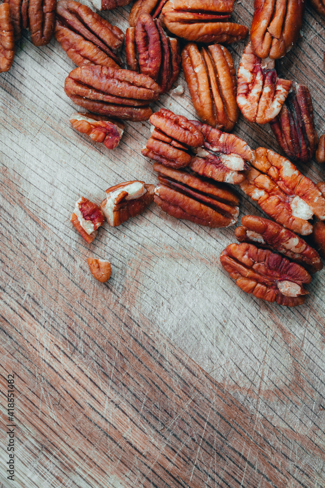 Pecan nuts on a wooden table