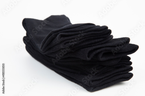 Black men's socks made of cotton on a white background.