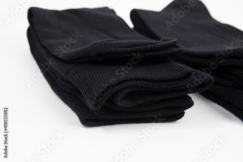 Black men's socks made of cotton on a white background.