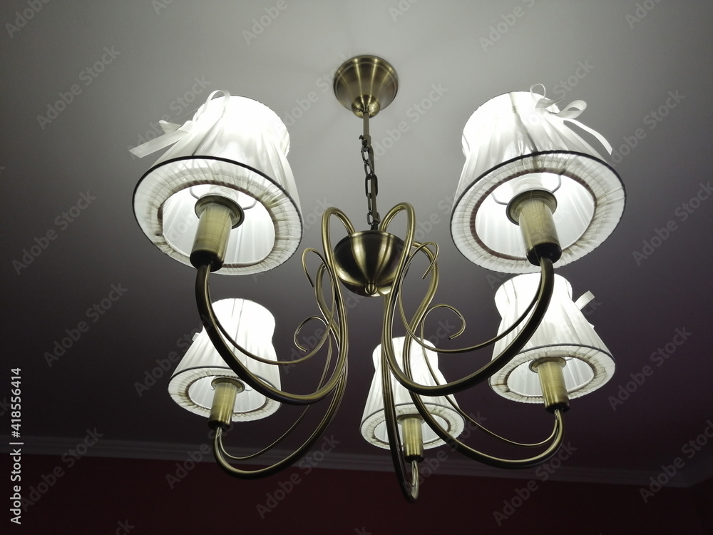 the chandelier glows in the dark. interior design, lighting