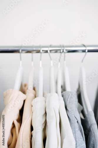 Circular Economy, Second hand, Fast fashion, Sustainable fashion. Many second hand clothes hanged on clothes rack © irissca