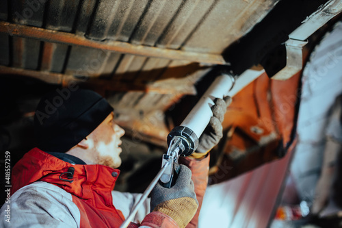 sealing of welded seams of a car with a sealant, body repair of transport.