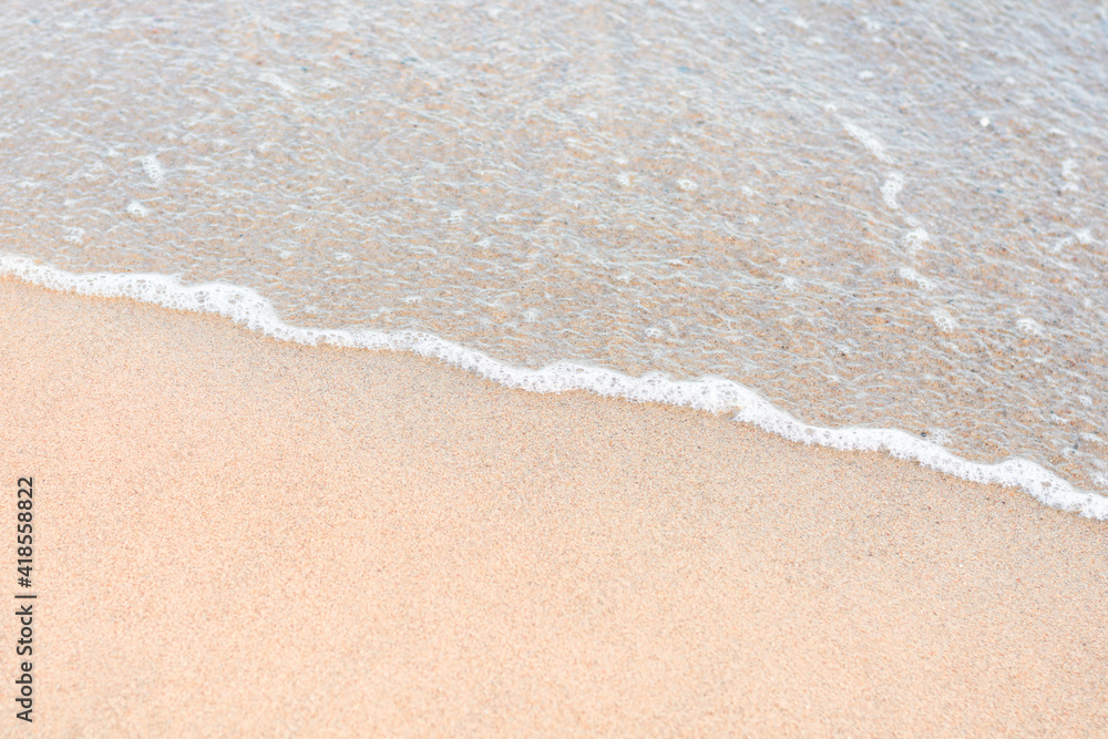 Soft sea wave running on sandy seashore. Selective focus, copy space Soft sea wave running on sandy seashore. Selective focus, copy space