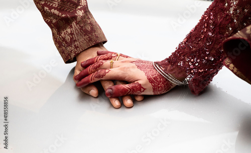 henna decorated hands of a bride in Georgetown, Penang photo