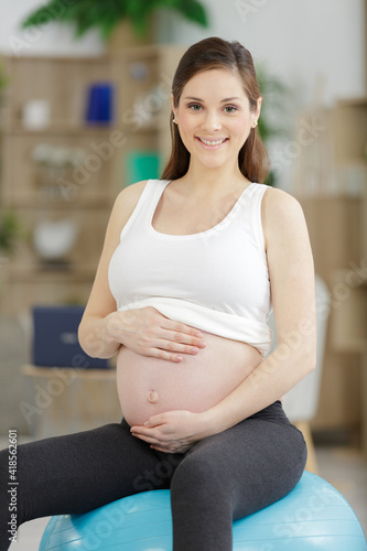 Free Download pregnant woman sitting on an aerobic ball - GFXLoad