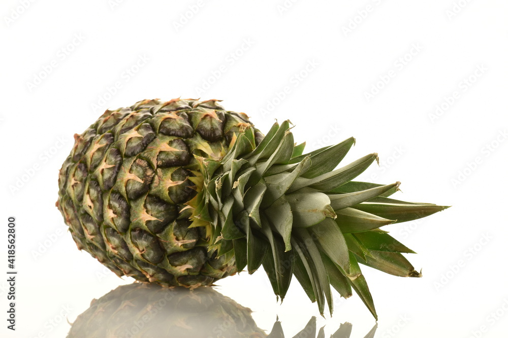 One ripe organic pineapple, close-up, isolated on white. One ripe organic pineapple, close-up, isolated on white.