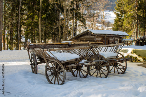 Old farm cart in the snow. photo