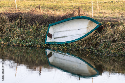 row boat at riverside photo