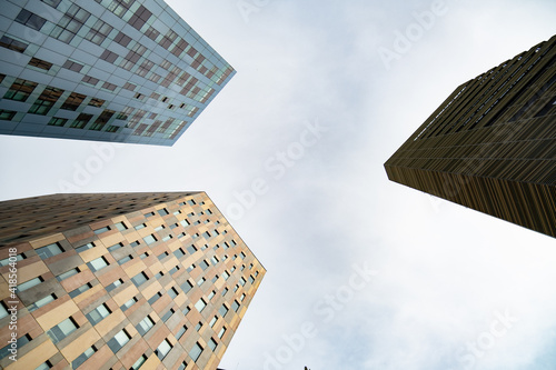 Office building. Modern glass building business center. Skyscraper in the city. Modern architecture. Building. Bottom view. Office building. Abstract architecture.  New building. 