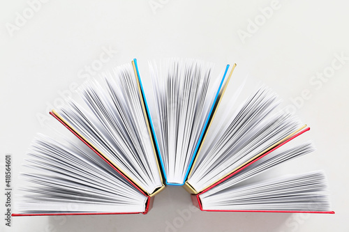 Stack of books on white bac...
