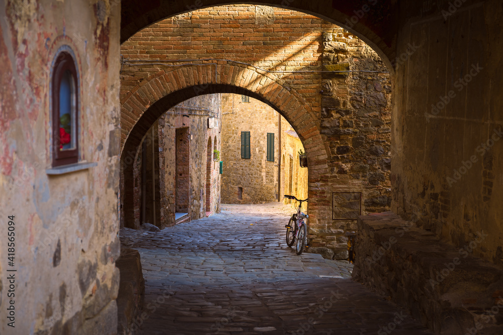 Alley going through a tunnel in Sant'Angelo in Colle, Montalcino, Italy