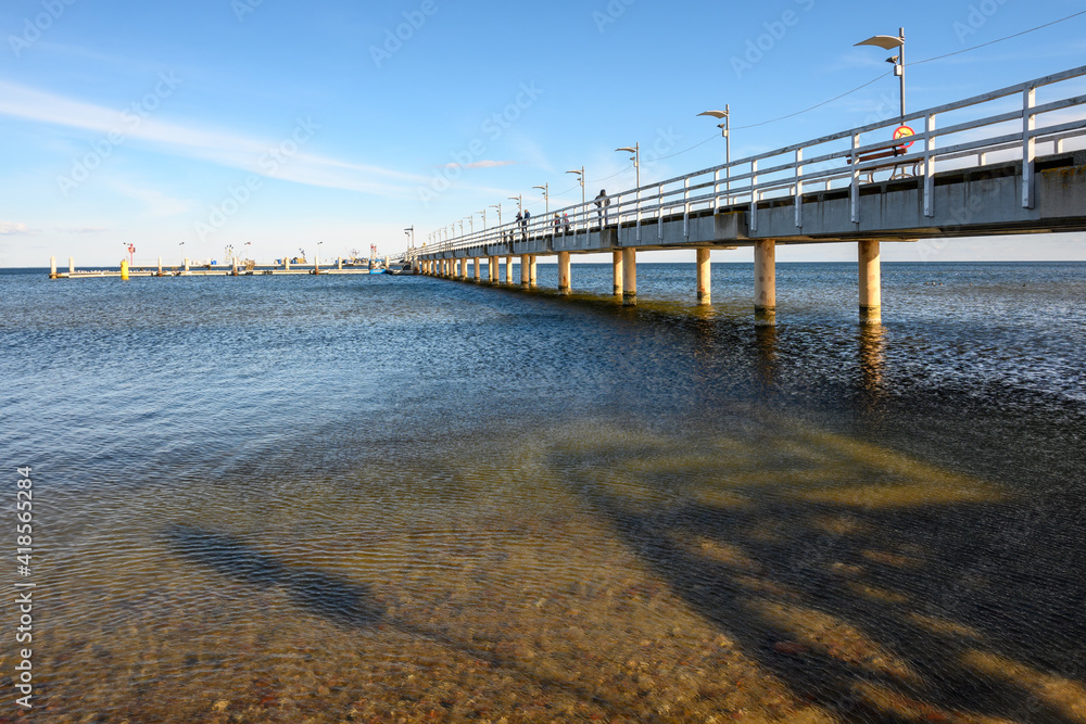 Fototapeta premium Pier in Mechelinki. Mechelinki is a fishing village and a popular tourist destination on the Baltic Sea in Poland