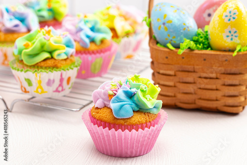 Pastel Rainbow Frosted Easter Cupcakes on a Kitchen Counter
