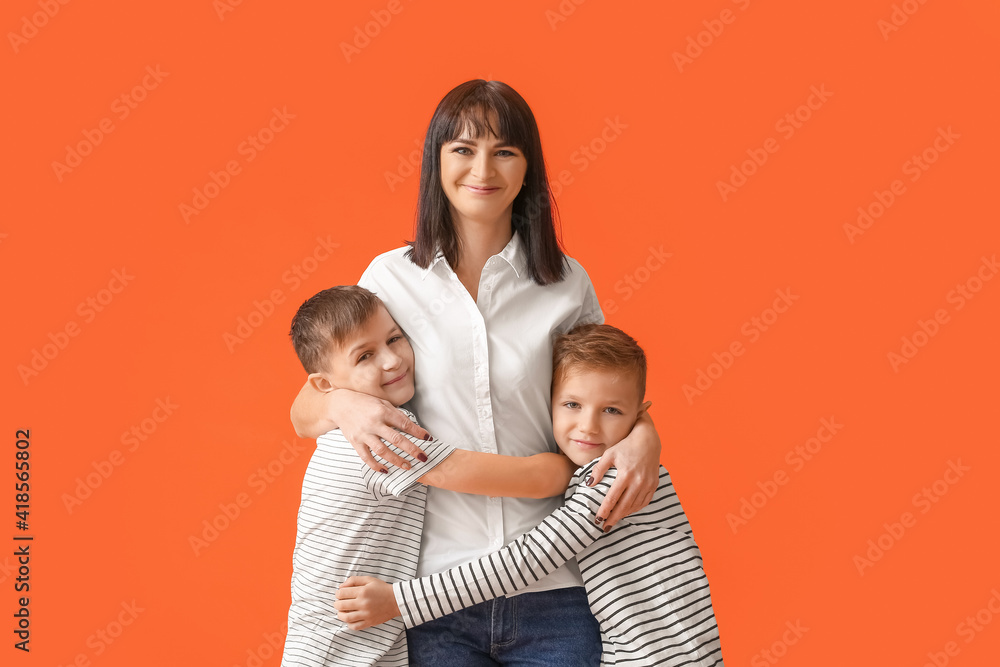 Happy mother and cute children on color background Happy mother and cute children on color background