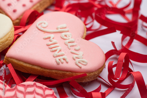 you're mine cookie with red confetti in the background  photo