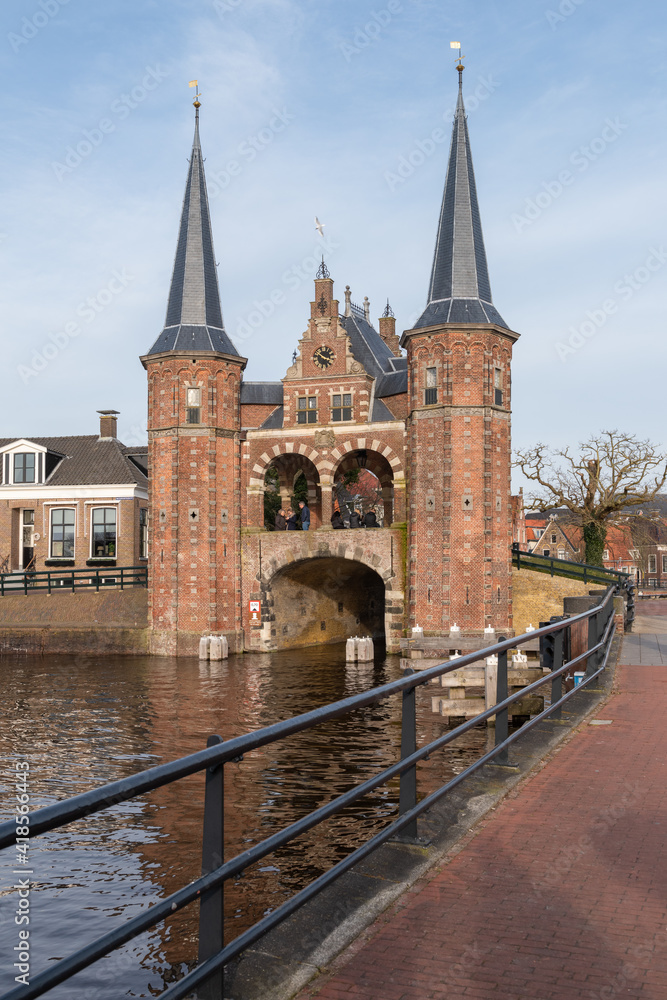 View of the historic Gate Waterpoort in the Dutch city of Sneek from the embankment