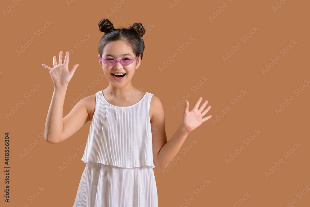 Happy little girl on color background Happy little girl on color background