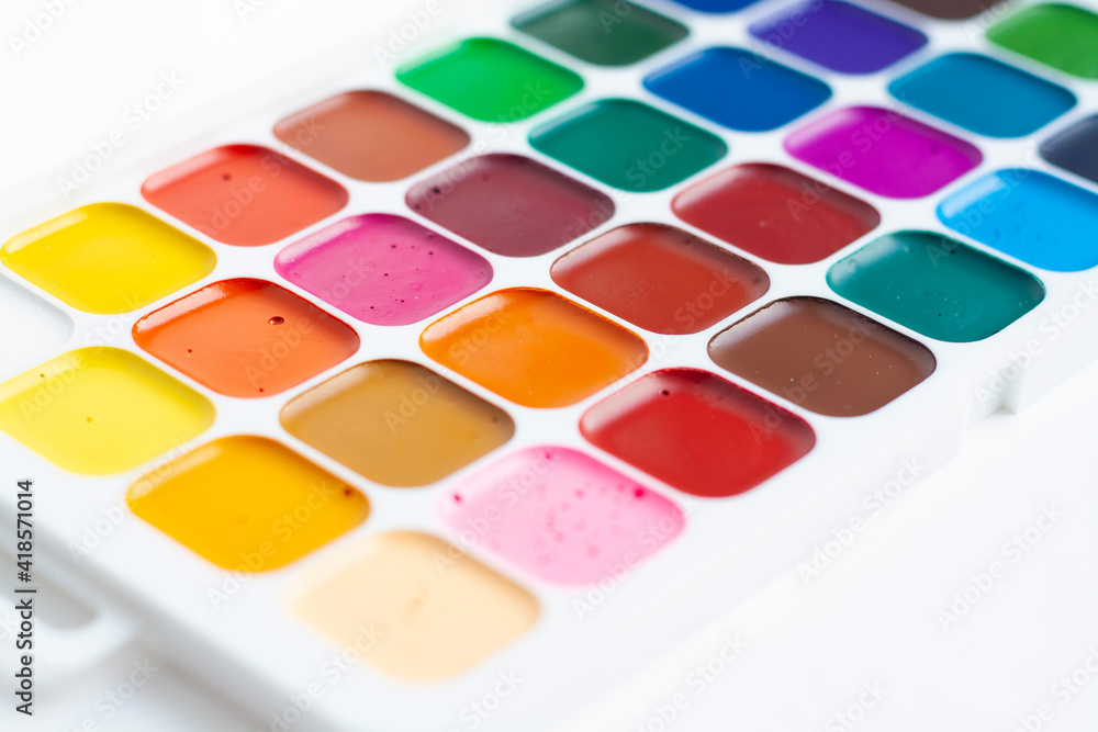 A palette of bright watercolors on a white background A palette of bright watercolors on a white background