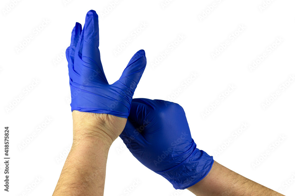 Doctor or nurse putting on or taking off blue nitrile surgical gloves, professional medical safety and hygiene for surgery and physical examination on white background Doctor or nurse putting on or taking off blue nitrile surgical gloves, professional medical safety and hygiene for surgery and physical examination on white background