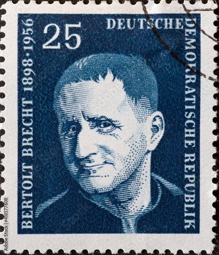GERMANY, DDR - CIRCA 1957 : a postage stamp from Germany, GDR showing a portrait of the playwright and poet Bertolt Brecht. blue