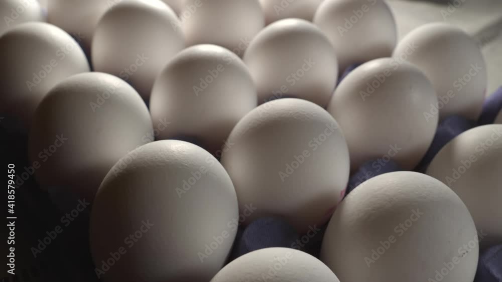 Closer look of the big white eggs on the tray found on top of the table. selective focus.close-up.footage Closer look of the big white eggs on the tray found on top of the table. selective focus.close-up.footage