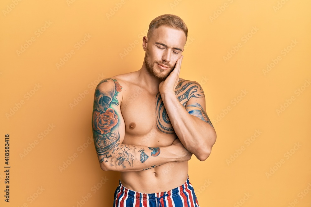 Young caucasian man wearing swimwear shirtless thinking looking tired and bored with depression problems with crossed arms.