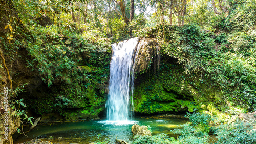 Fototapeta Naklejka Na Ścianę i Meble -  Corbett Falls is a scenic water fall and is surrounded by dense teak wood forest